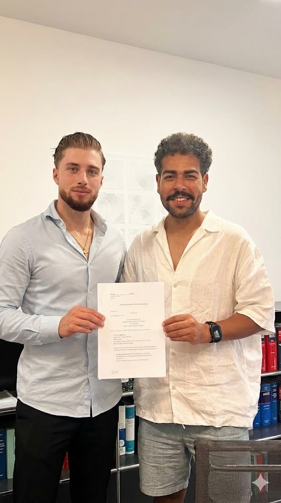 Client holding signed property purchase contract with Moderna advisor